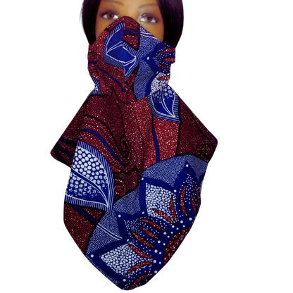 The Burgundy Floral Panda Scarf & Mask features rich, red base colors adorned with detailed patterns in blue and white, as shown in the image. The patterns are geometric and symmetrical, giving the scarves an elegant look. There is a sparkling effect on the entire scarf, suggesting that it might have a glittery or glossy texture. 